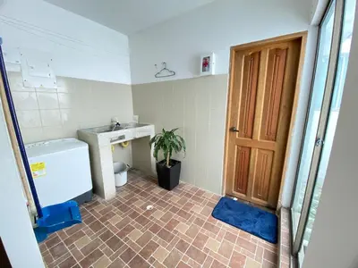 a bathroom with a toilet and a sink and a door at Apartamento la Isla 2-Coveñas in Coveñas