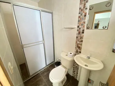 a bathroom with a toilet and a sink at Apartamento la Isla 2-Coveñas in Coveñas