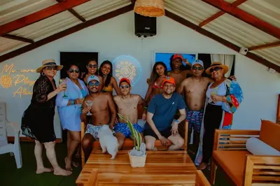 a group of people posing for a picture at a party at Solarium Beach Club in Playa Blanca