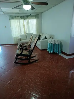 a living room with two chairs and a couch at Beach Airport House in Cartagena de Indias