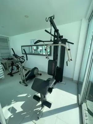 a gym with two exercise bikes in a room at Magico Apartamento Frente al Mar 4 Habitaciones O62 in Coveñas