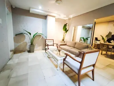 a living room with a couch and a table at Capitel Hostel in Cartagena de Indias