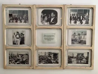 a group of pictures in a window on a wall at Hostel Mamy Dorme in Barranquilla