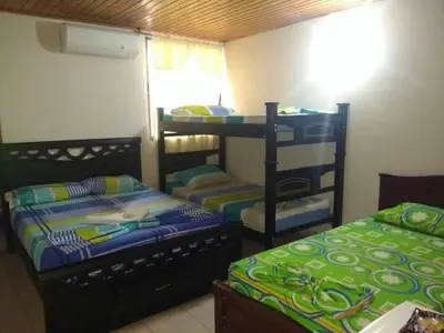 a room with two bunk beds and a bunk bed at Hotel Colonial Inn in Barranquilla
