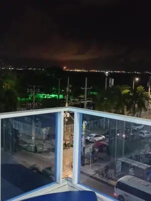 a view of a parking lot at night from a balcony at AL-1C APARTAMENTO DE 1 ALCOBA CERCA AL MAR AIRE ACONDICIONADO WIFi Y PISCINA in Cartagena de Indias