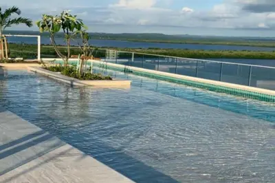a swimming pool on top of a building with water at Apartamento en edificio con espectacular terraza in Cartagena de Indias