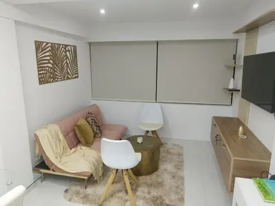 a living room with a couch and a chair at Apartamento moderno frente al mar in Cartagena de Indias