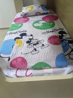 a bed with a cake on top of it at Cabañas OnBeach in San Antero
