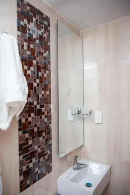 a bathroom with a sink and a mirror at CASA PETRA in Cartagena de Indias