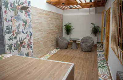 a room with a table and some plants in it at CASA PETRA in Cartagena de Indias