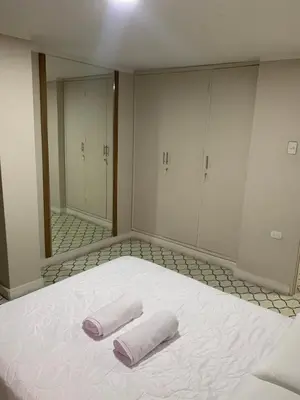 two towels on a bed in a room with a mirror at Apartahotel Edificio Baquero x5 Apto 301 in Barranquilla