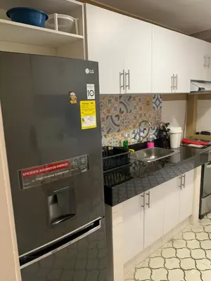 a kitchen with a stainless steel appliance in a kitchen at Apartahotel Edificio Baquero x5 Apto 301 in Barranquilla