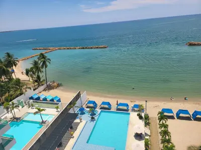 an aerial view of a beach and a swimming pool at Yellow beach & rest in Coveñas