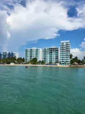 a view of a city from the water with buildings at Yellow beach & rest in Coveñas