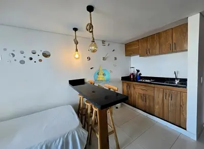 a kitchen with a table in the corner of a room at Estudio Vista Laguna y Mar Piso 14 in Cartagena de Indias