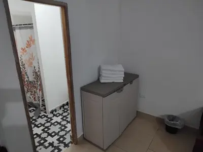 a bathroom with a dresser and a mirror at La Casa del Mar - Hotel Familiar en San Bernardo del Viento in San Bernardo del Viento