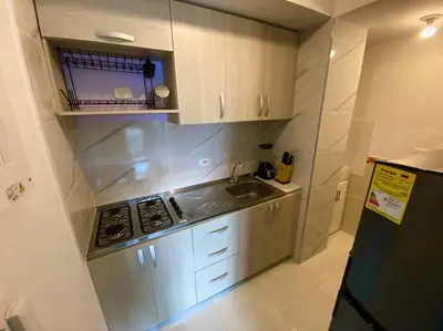 a small kitchen with a sink and a stove at Nice apartment close to the Marbella beach in Cartagena de Indias