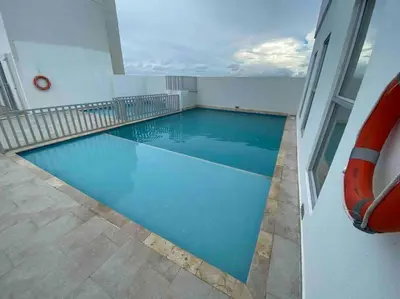 a swimming pool in the middle of a building at Nice apartment close to the Marbella beach in Cartagena de Indias