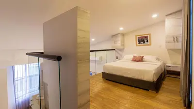 a small bedroom with a bed and a bathroom at Cartagena Suites de Manga in Cartagena de Indias