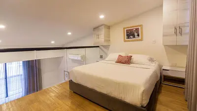 a small bedroom with a bed and a window at Cartagena Suites de Manga in Cartagena de Indias
