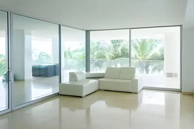 a living room with white furniture and large windows at 2 dormitorios Morros. Vista Panorámica y salida Playa in Cartagena de Indias