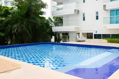 a swimming pool in front of a building at 2 dormitorios Morros. Vista Panorámica y salida Playa in Cartagena de Indias