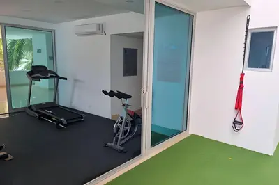 a gym with two exercise bikes and a mirror at 2 dormitorios Morros. Vista Panorámica y salida Playa in Cartagena de Indias
