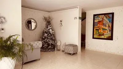 a living room with a christmas tree in the corner at !Aprovecha Excelente Apartamento Para Vacacionar en Cartagena in Cartagena de Indias