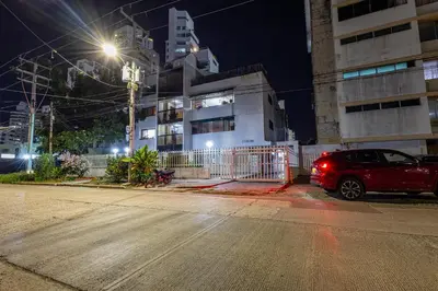 a car parked on the side of a street at night at APARTAMENTO CATALINA BOCAGRANDE 1b in Cartagena de Indias