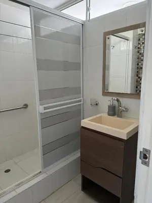 a bathroom with a sink and a shower at Perla Santa - Luxury Condo in Santa Marta