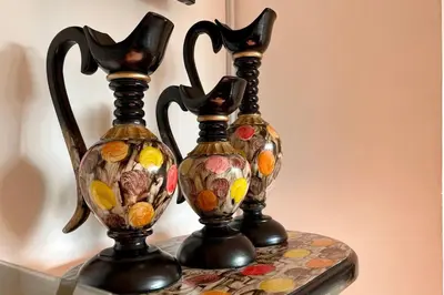two vases sitting on top of a table at Gorgeous 8 BR House w/ Pool in the Old City in Cartagena de Indias