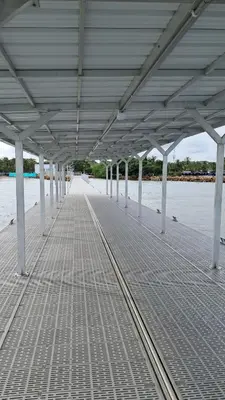 a pier with white poles and the water at Piantini Houses in Coveñas