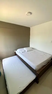 a bedroom with two beds in a room at Tu lugar ideal cerca al mar apartamento MyM in Coveñas