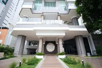 a large white building with a walkway in front of it at COMFORTABLE DEPARTAMENT IN FRONT THE SEA in Cartagena de Indias