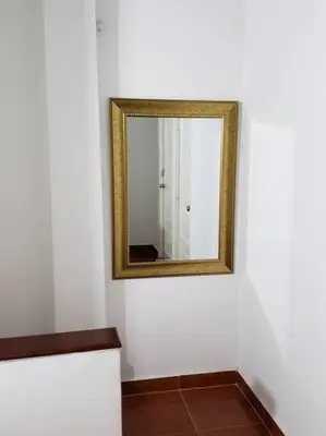 a mirror on a wall in a room at Apartamento en Centro Histórico De Cartagena in Cartagena de Indias