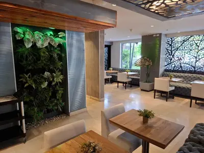 a large indoor plant wall in a restaurant at Washington Plaza in Barranquilla