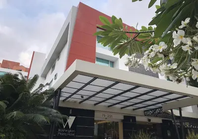 a building with a red and white building at Washington Plaza in Barranquilla