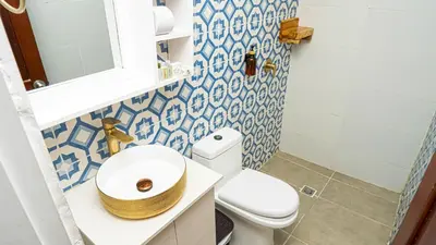 a bathroom with a toilet and a sink at CASA PLAYA JAMES in La Boquilla