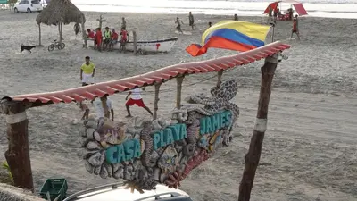 a sign for a bar on the beach at CASA PLAYA JAMES in La Boquilla