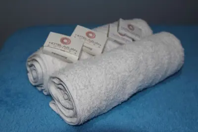 a roll of white toilet paper on a blue table at Azuán Suites Hotel By GEH Suites in Cartagena de Indias