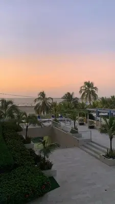 a view of the beach from a resort at sunset at Apartamento Cartagena Morros Epic in Cartagena de Indias