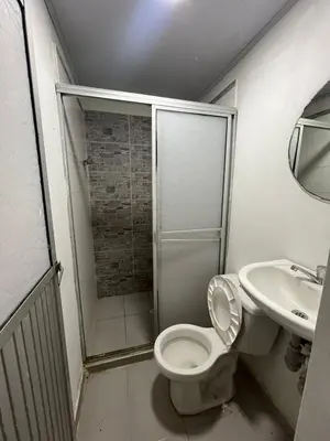 a bathroom with a shower and a toilet and a sink at Apartamento VIVAMAR Manantial in Cartagena de Indias