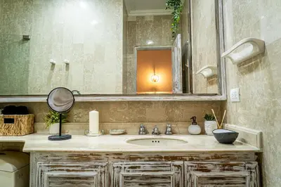 a bathroom with a sink and a mirror at Edificio Ayos dentro la ciudad amurallada in Cartagena de Indias