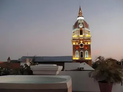 a clock tower on top of a building at Edificio Ayos dentro la ciudad amurallada in Cartagena de Indias