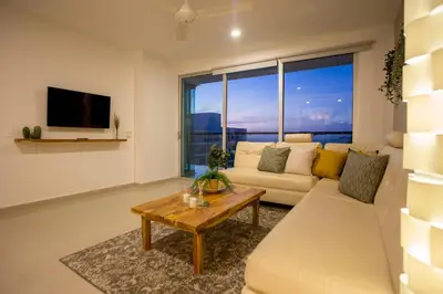 a living room with a couch and a table at Condominio frente al mar con acceso directo a la playa Morros Ultra in Cartagena de Indias
