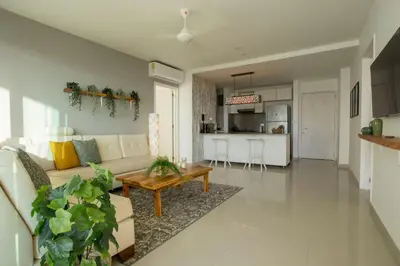 a living room with a couch and a table at Condominio frente al mar con acceso directo a la playa Morros Ultra in Cartagena de Indias