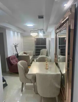 a living room with a table and chairs at APARTAMENTO NUEVo in Cartagena de Indias