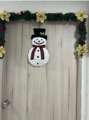 a christmas decoration of a snowman hanging on a door at APARTAMENTO NUEVo in Cartagena de Indias