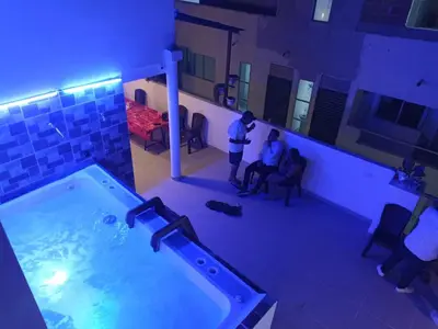 two men standing in a room with a tub at Dreimar Hotel Boutique in Cartagena de Indias