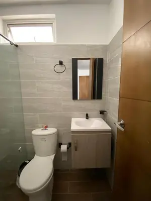a bathroom with a toilet and a sink at Apartamento Villa Mary-Coveñas in Coveñas